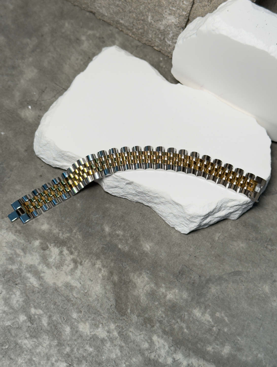 Roly Statement Bracelet - Gold-Toned Design on White Surface Product Image