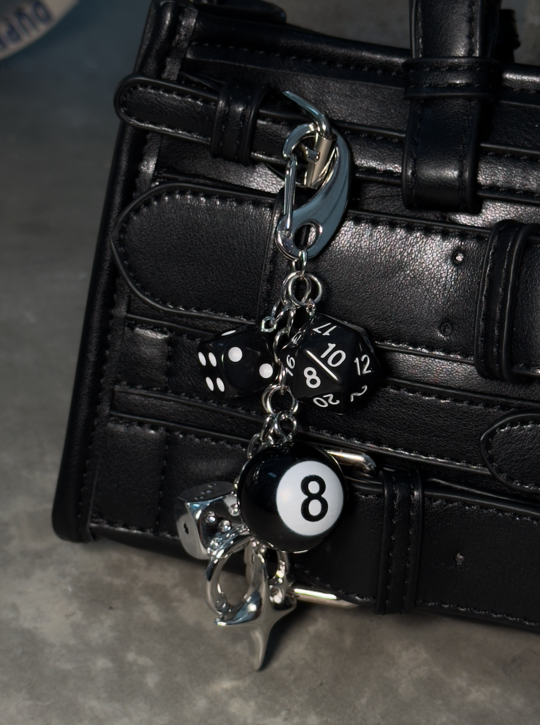 Dice Bag Charm with Assorted Dice Designs and Secure Hook Attachment